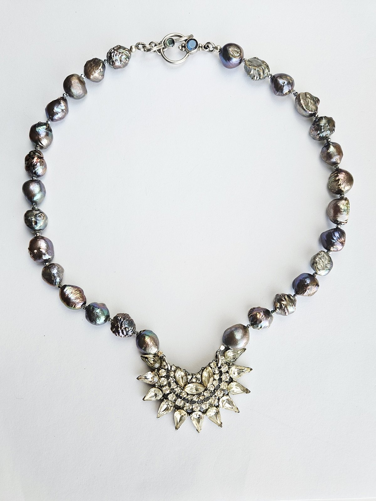 rhinestone vintage pendant on pearl necklace