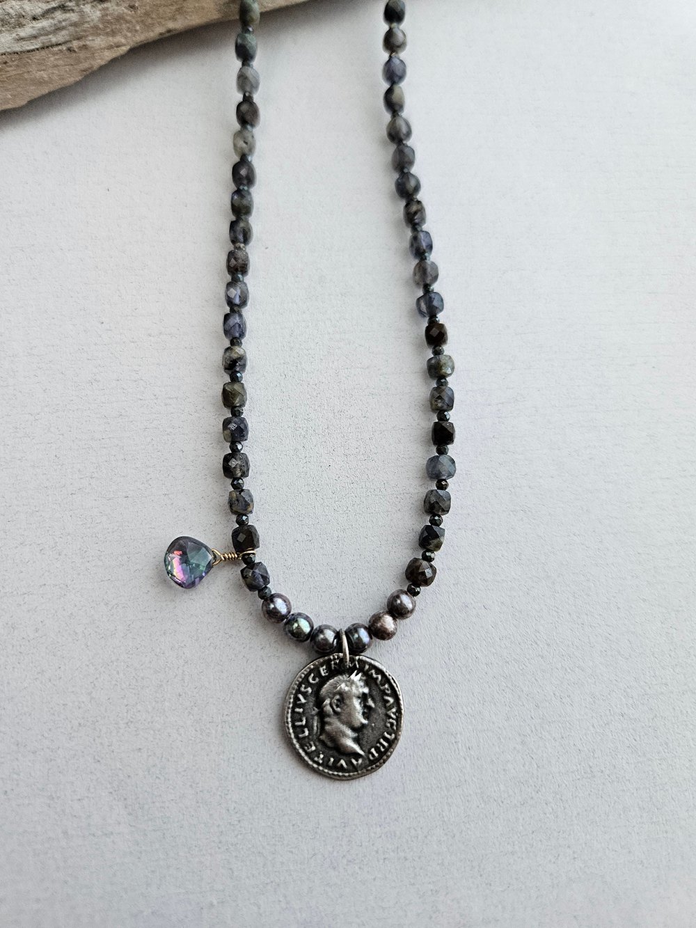 Handcrafted iolite necklace with vintage coin, pearls, and mystic topaz
