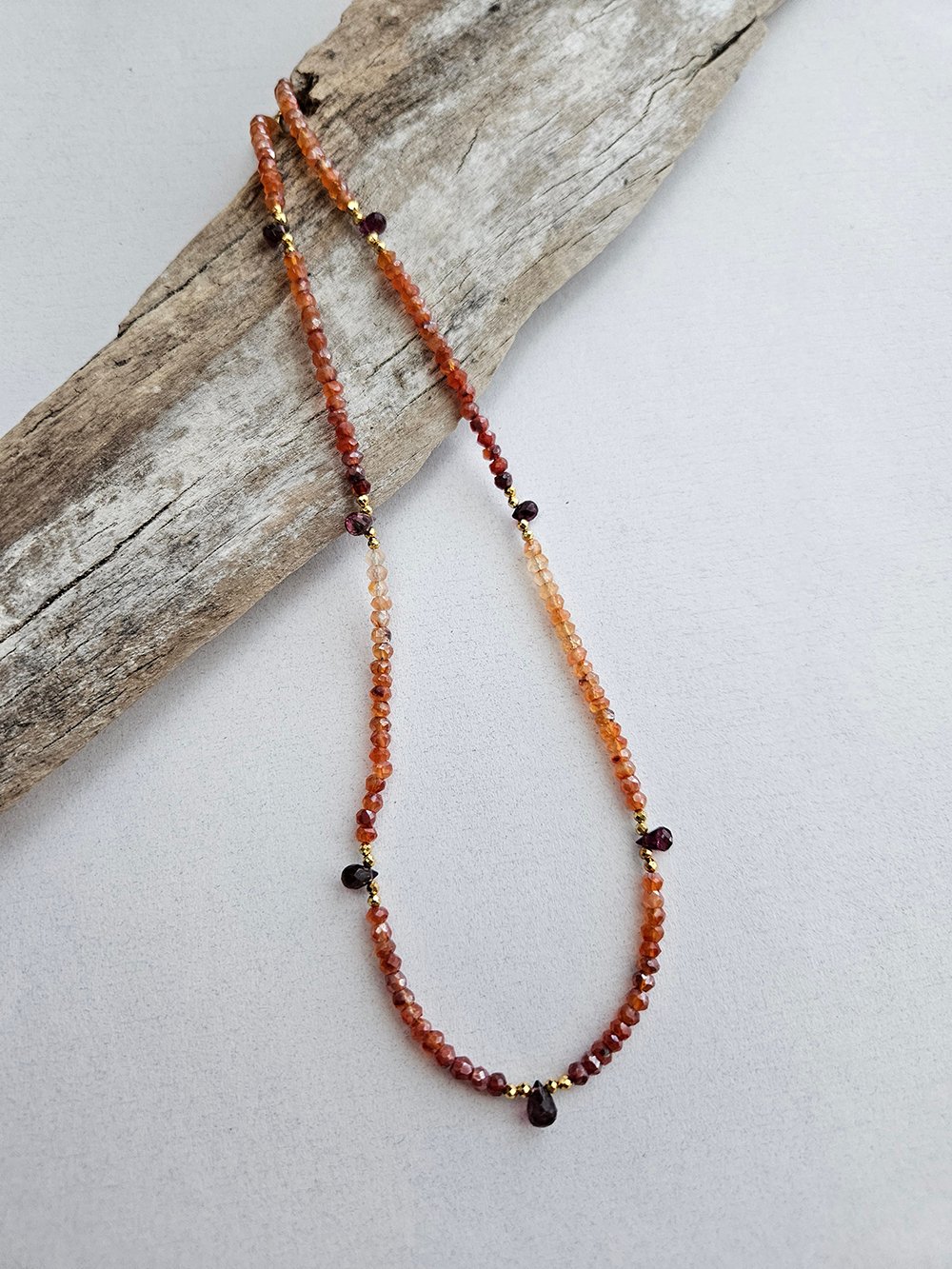 Handcrafted carnelian necklace with rubylite briolettes and pyrite accents