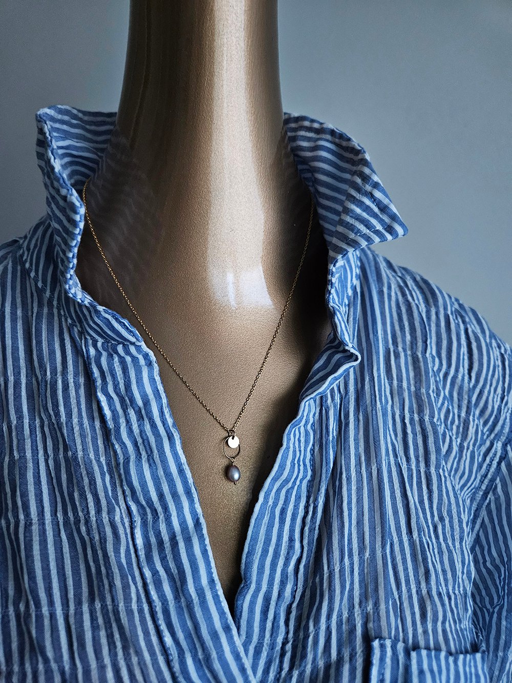 Short Image Alt Text (Picture Description) Handcrafted freshwater pearl necklace with cream pearl on circle link and gold disc